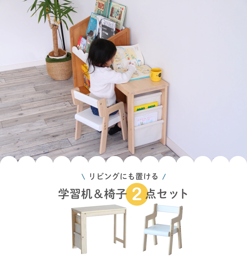 こども部屋で椅子に座って学習机で絵を描くこどもの画像